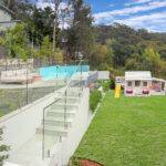 Backyard landscaping with kids playhouse