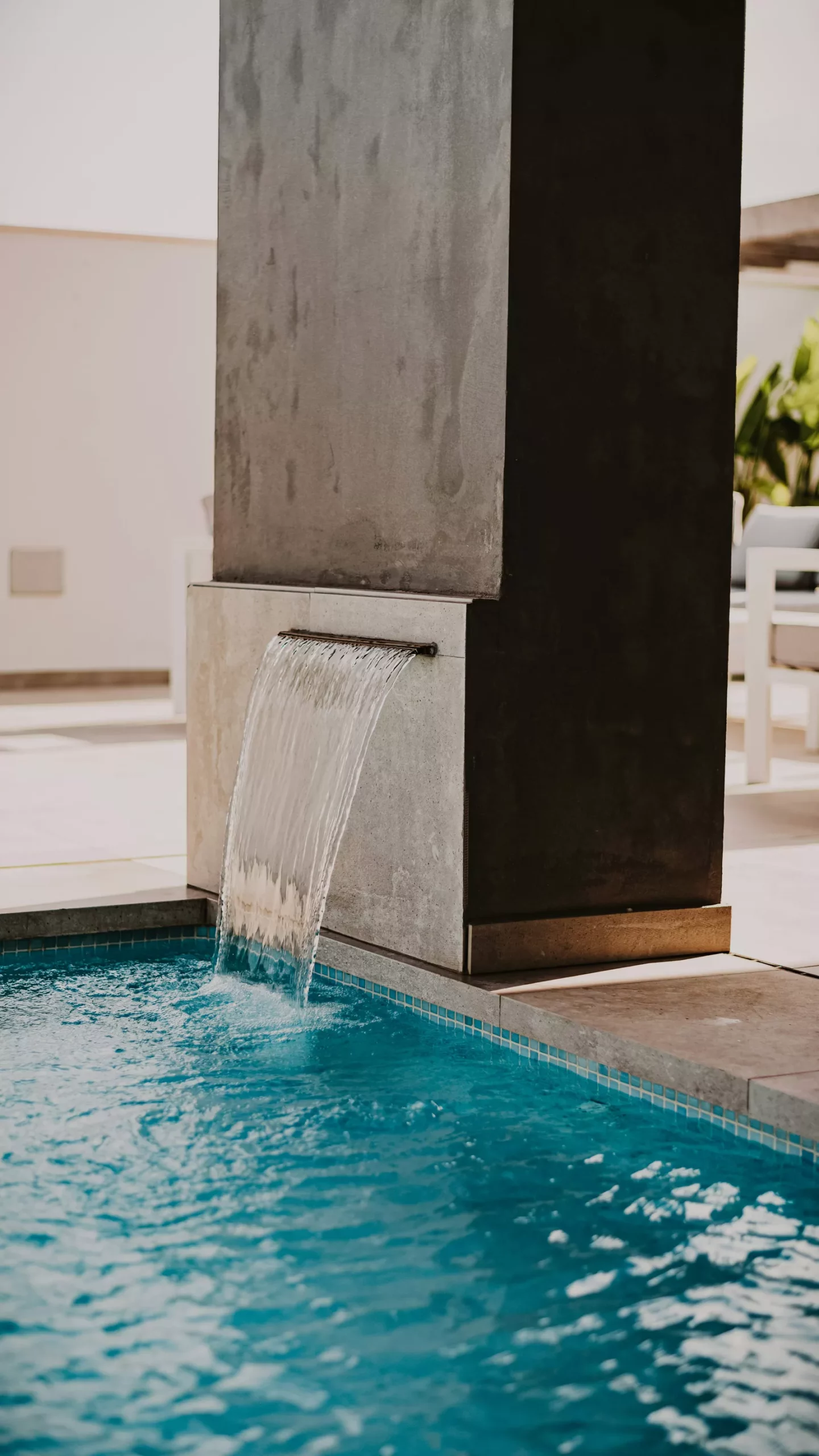 Modern fountain into pool